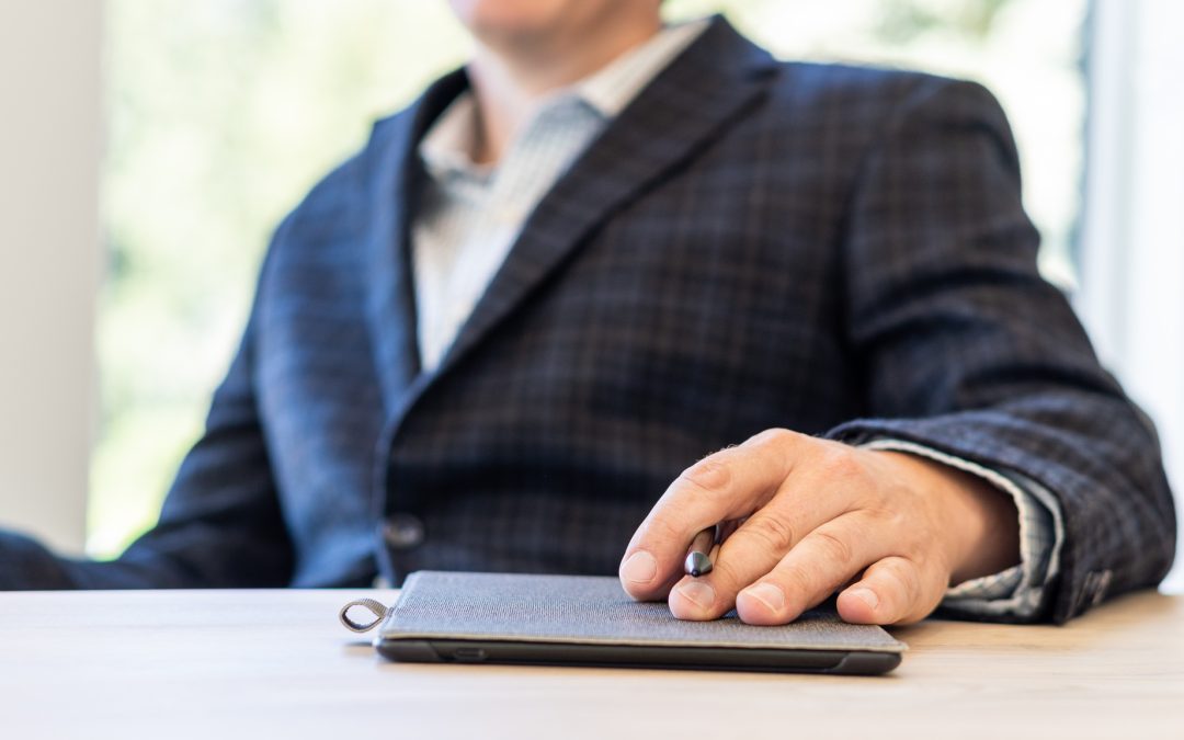 Investment relations team member working on tablet